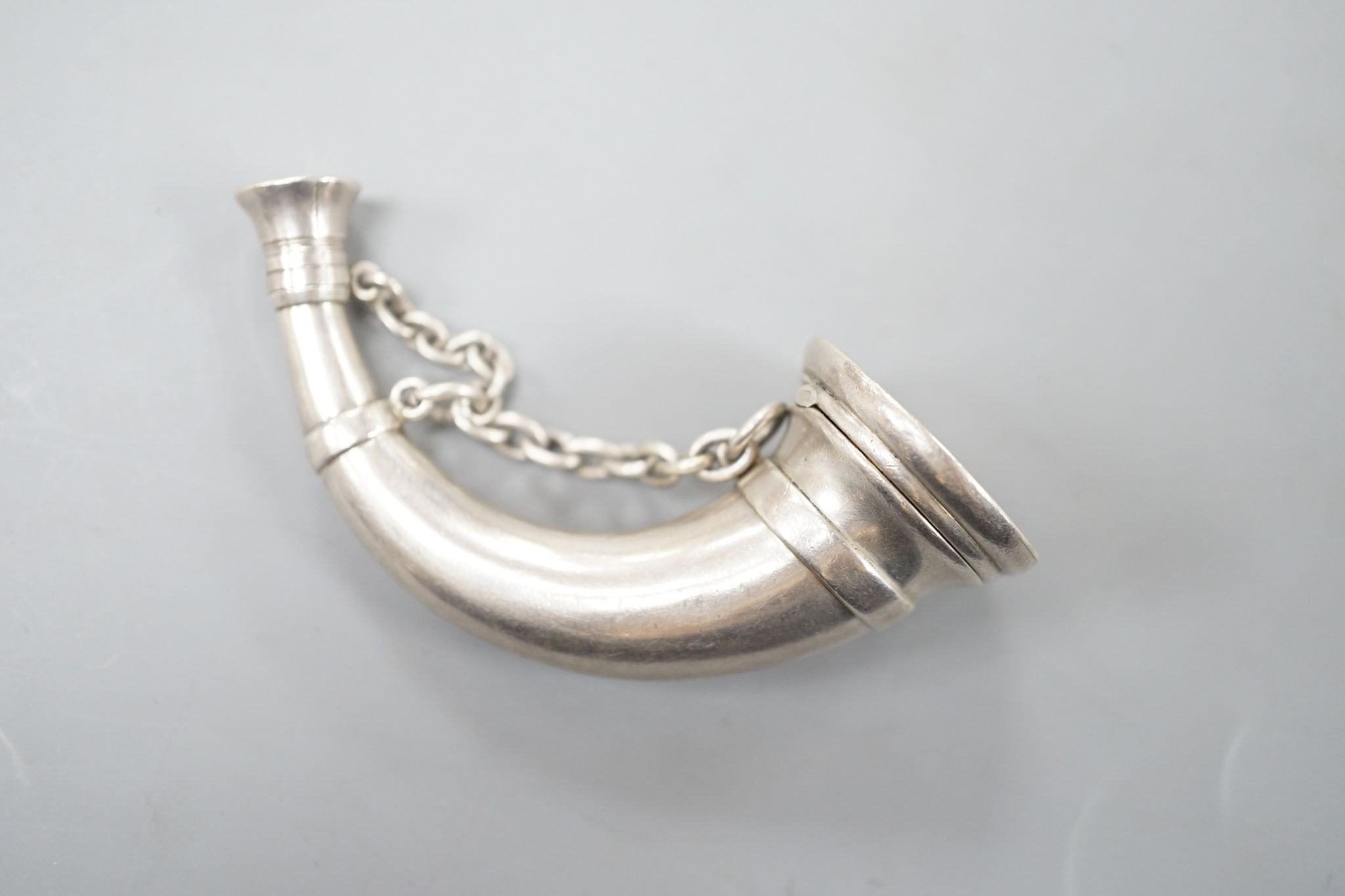 A Victorian novelty silver vinaigrette, modelled as a hunting horn, by Sampson Mordan & Co, London, 1874, 76mm, with engraved initials.